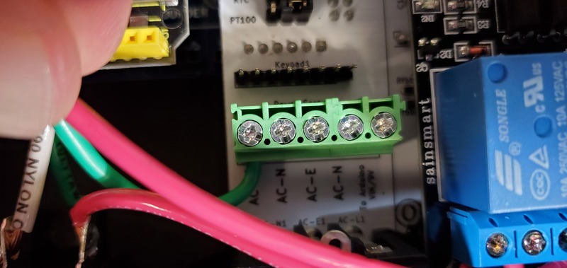 Installing first AC outlet wire to PCB terminal block